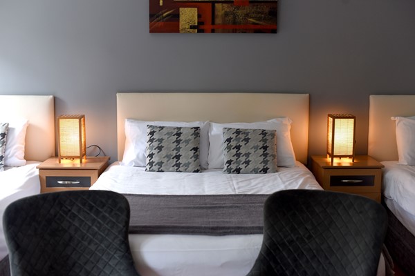 An image labelled 1 Doubles - 2 Singles Standard Room