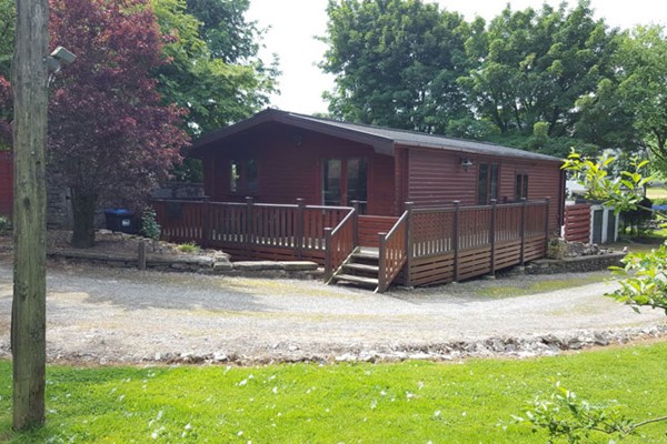 An image labelled Sleeps 6 Lodge