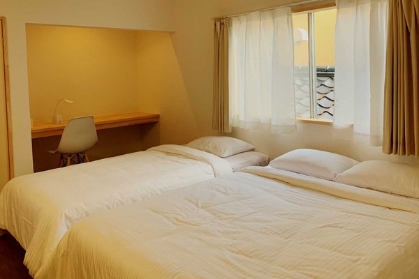 An image labelled Deluxe Triple Room