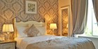 An image labelled Comfortable and relaxing hotel bedrooms