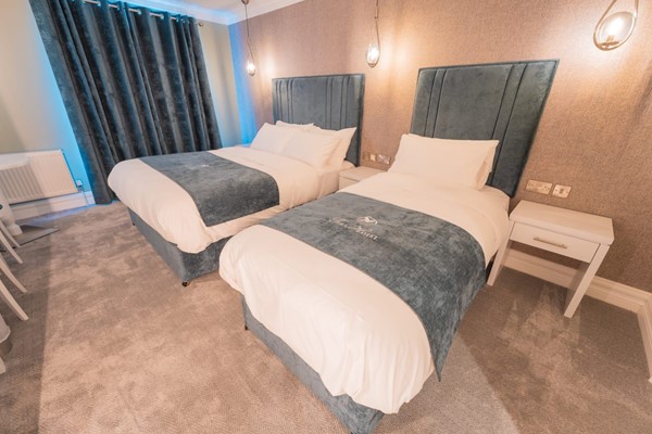 An image labelled Double and Single Town View Triple Room
