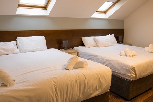 An image labelled Double and 3 Singles Apartment