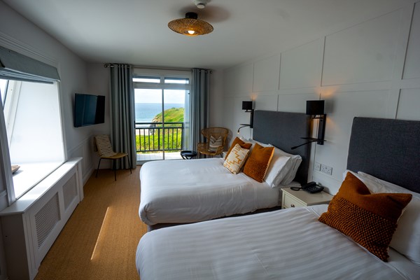 An image labelled Sea View & Balcony Family Twin Room