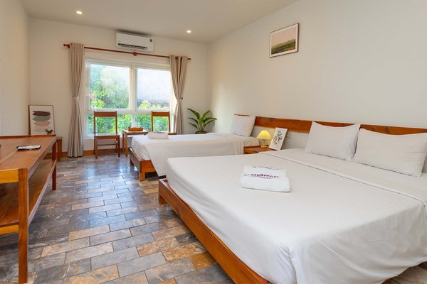 An image labelled Superior Triple Room