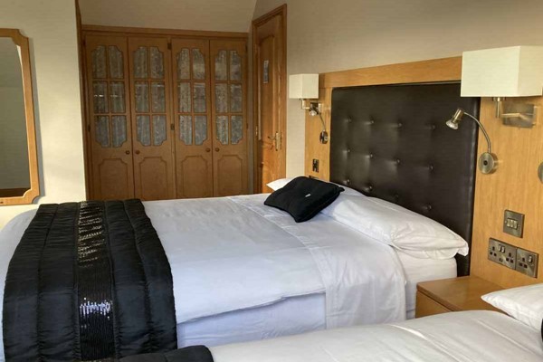 An image labelled Double and 2 Singles Room