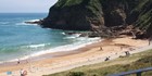 An image labelled Greve de Lecq Beach