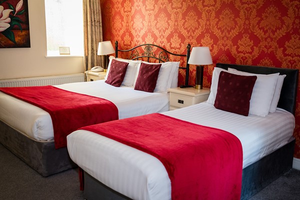 An image labelled Triple Room