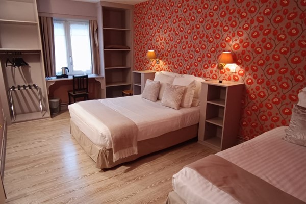 An image labelled Double and Single Triple Comfort Room