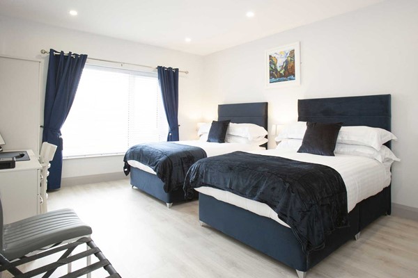 An image labelled Luxury Twin Room