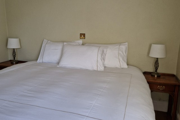 An image labelled Deluxe Double/Twin Private Ensuite Room