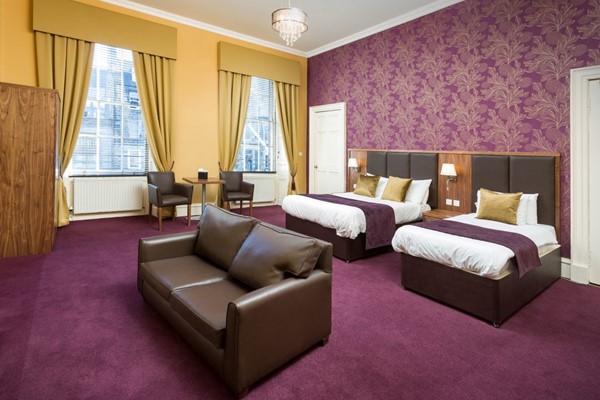 An image labelled Triple Room