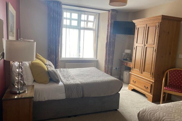 An image labelled Triple Room