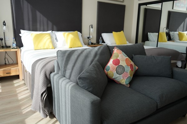 An image labelled Superior Double & Single w/ Sofa Bed Room