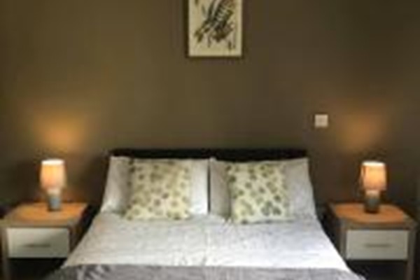 An image labelled 1 Doubles - 2 Singles Garden View Apartment