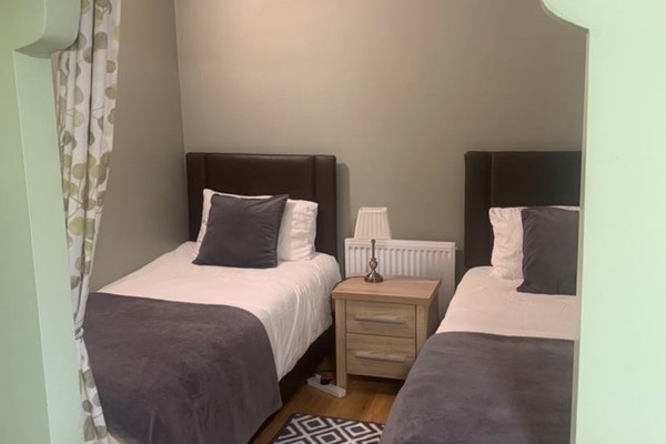 An image labelled 1 Doubles - 2 Singles Studio Apartment