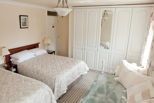 An image labelled 1 Double - 3 Singles Quad Room