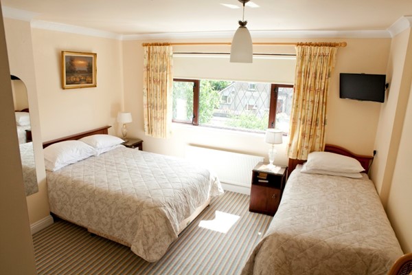 An image labelled Double and Single Triple Room